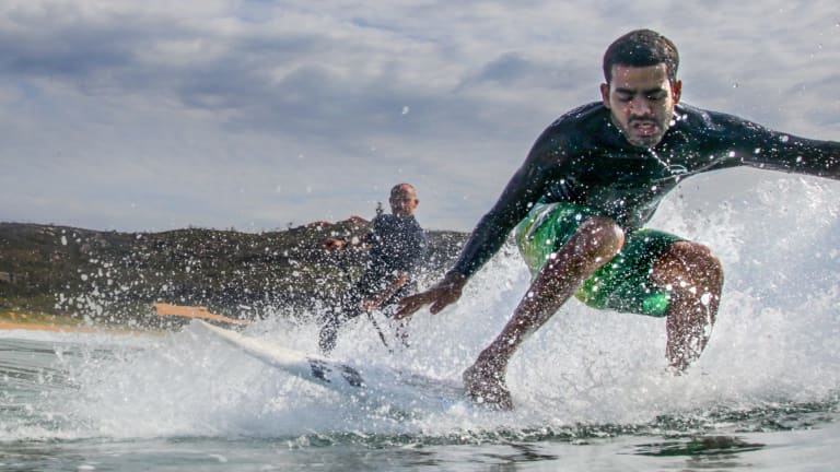 Blind surfer Derek Rabelo learns from Australian legend Tom Carroll