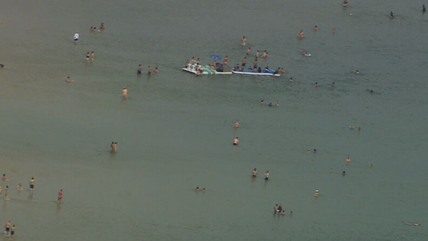 People at beach in Melbourne during heatwave