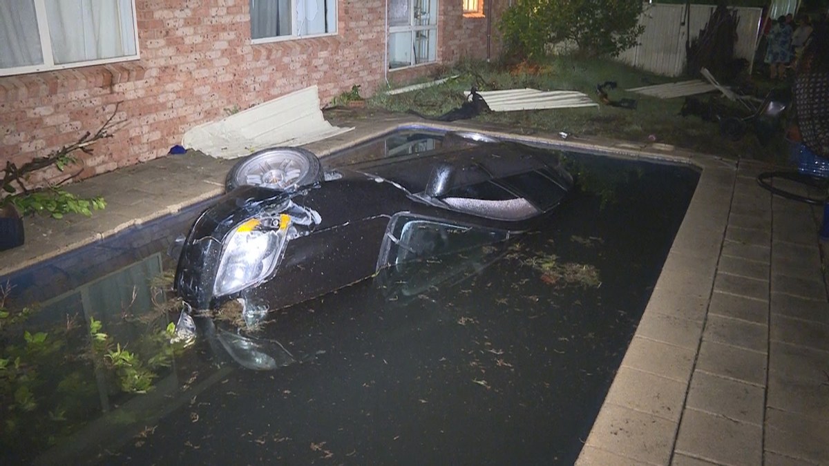 Prestons car into pool: Driver makes soggy escape after crashing car ...