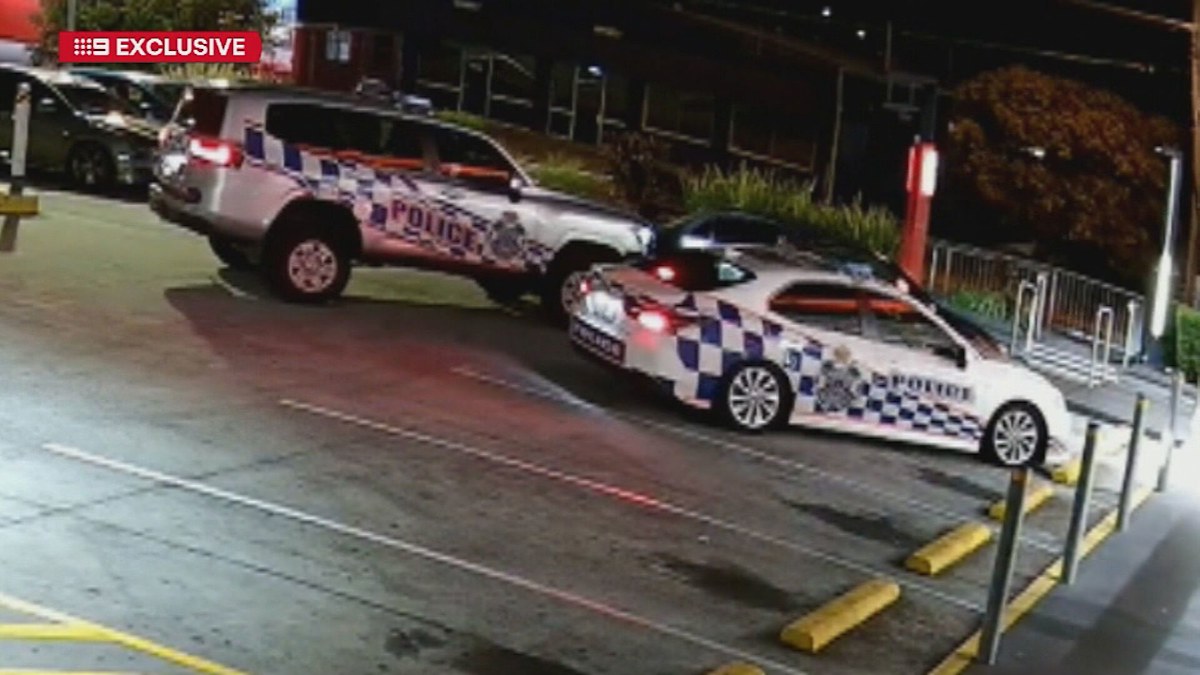 Woman charged after allegedly ramming police cars in Hungry Jack's car ...