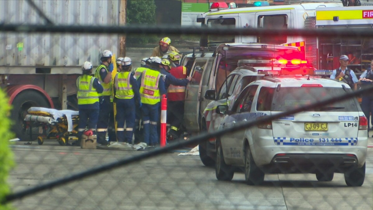 Sydney man killed after car crashes into trailer at Moorebank warehouse ...