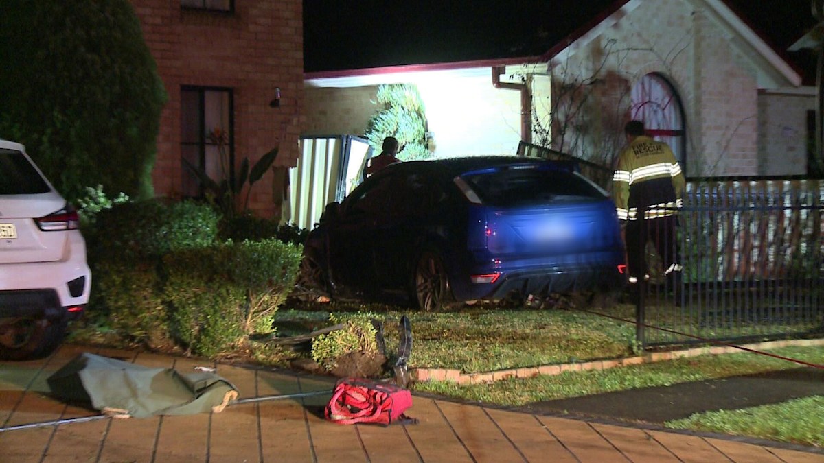 Man charged after car crashes into home during police chase in Sydney's ...
