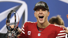 SANTA CLARA, CALIFORNIA - JANUARY 28: Brock Purdy #13 of the San Francisco 49ers reacts as he holds the George Halas Trophy after defeating the Detroit Lions 34-31 in the NFC Championship Game at Levi's Stadium on January 28, 2024 in Santa Clara, California. (Photo by Ezra Shaw/Getty Images)