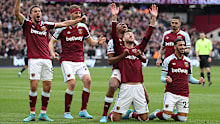 Andriy Yarmolenko drops to his knees after scoring. 