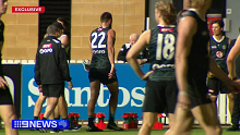 Charlie Dixon limps off the field at Port Adelaide training. 