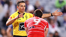 Referee Gerard Sutton awards a penalty.