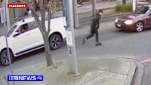 The man fled in a stolen car, with the getaway driver seen dancing to rap music as he drove.