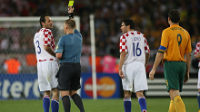 Graham Poll showed a second yellow card to Josip Simunic, but the defender remained on the field.