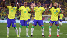 Vinicius Jr, Raphinha, Lucas Paqueta and Neymar dance after the former's goal. 