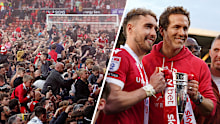 Fans stormed the pitch after Wrexham secured promotion to the Championship, and Ryan Reynolds and Sam Smith pose for a photo with the trophy.