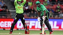 Andre Russell and Sam Billings react after the ball hits the stumps, but doesn't knock the bails off.