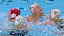 Stingers players embrace in the pool after beating Greece.