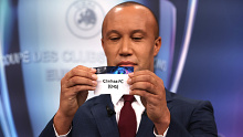 Mikael Silvestre draws out the card of Chelsea FC during Friday's Champions League draw.