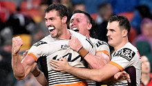 Corey Oates celebrates a try for the Broncos.