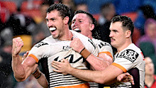 Corey Oates celebrates a try for the Broncos.