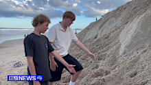 A teenager on the Gold Coast had a lucky escape yesterday after becoming trapped in a collapsing sandbank at Broadbeach.
