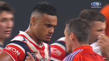 Roosters prop Spencer Leniu with referee Adam Gee.
