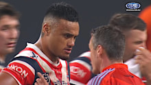 Roosters prop Spencer Leniu with referee Adam Gee.
