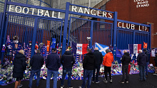 Fans gather outside Ibrox to pay their respects to Walter Smith. 