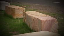 Mystery surrounds the disappearance of 25 tonnes of sandstone blocks from the side of one of Lake Macquarie's busiest roads.
