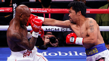 Manny Pacquiao punches Yordenis Ugas during their title fight. 