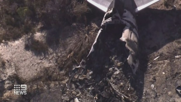 The miracle men who walked away from a crashed Boeing 737 in Western Australia were initially trapped in the burning plane before managing to open a window to escape.The new details have been revealed in a preliminary report into the crash, which happened in February.