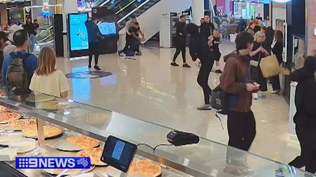 Shoppers and staff have recalled the moment they felt they were running for their lives as a wild brawl erupted between gangs with machetes inside a Melbourne shopping centre.Four youths have been arrested over the violent attack, with two already out on bail.