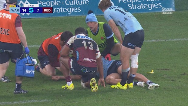 Joseph-Aukuso Suaalii is stretchered off after copping a knee from Andrew Kellaway.
