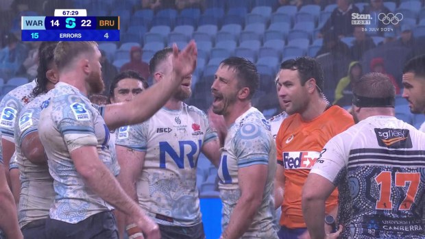 Jake Gordon and Waratahs players complain to the referee about one of his calls.