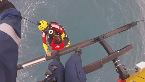 Three people have been rescued after their boat overturned on the NSW South Coast.