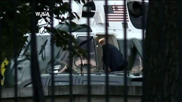 After giving reporters a thumbs up, Mr Trump boarded Marine One.