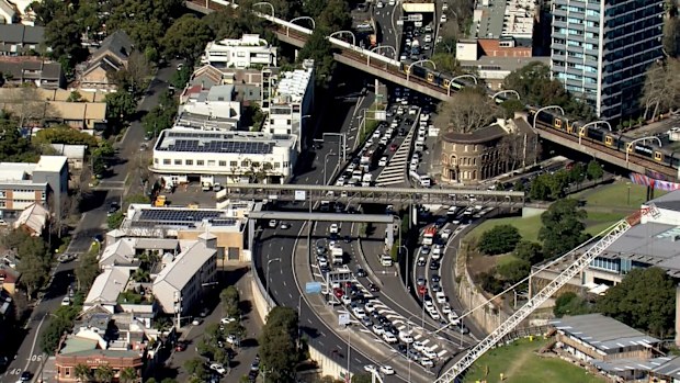 Heavy delays north and southbound after car burst into flames inside Sydney Harbour Tunnel. 