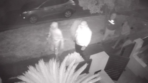 A man has been viciously beaten by a group of masked and armed attackers in front of two teenage girls during a home invasion in Western Sydney. 