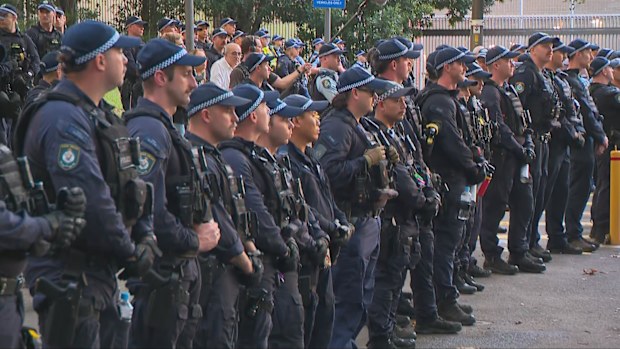 Lines of police outside Surry Hills Police Station. 
