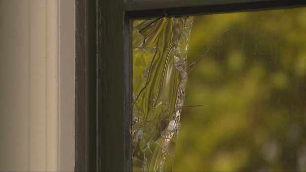 A NSW Parliament House window was smashed with a metal barbell early this morning.