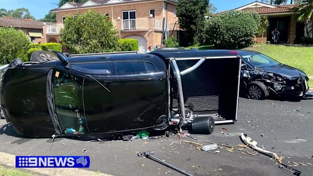 A search is under way for a father who pulled his children from a vehicle and fled a collision at Menai in Sydney's south.Witnesses raced to the rescue of a woman stuck in one car before emergency services took over.