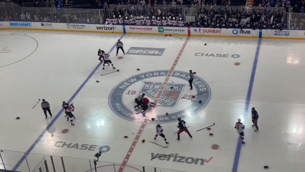 Players trade blows all over the ice.