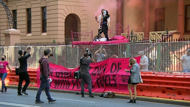 A protest is underway outside NSW Parliament. 