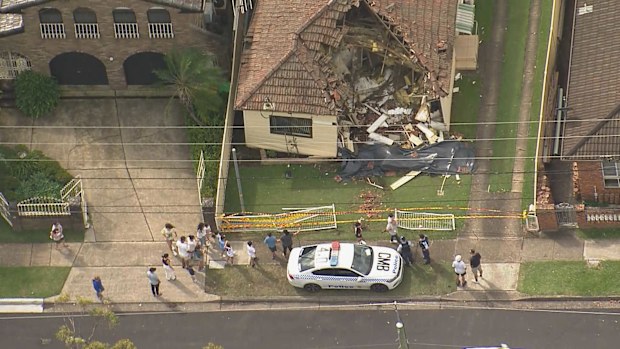 Dramatic pictures show a bus which crashed into a house in Sydney's West.The accident happened 10am, police say.
The bus hit the home on Guildford Road, Guildford, smashing down walls and collapsing part of the roof.