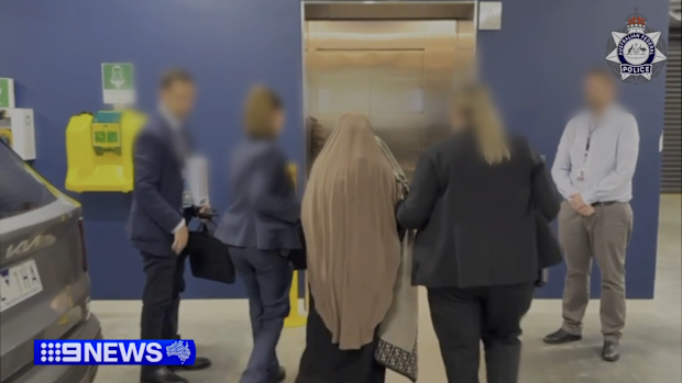 Kawsar Ahmad during her arrest at Melbourne Airport on May 7, 2026.