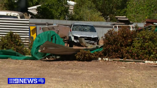 A Willaston resident was confronted by an axe-wielding driver who smashed into his backyard during a wild police chase.