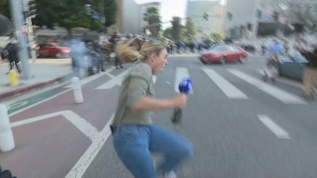 Aussie reporter caught in crossfire of violent protests