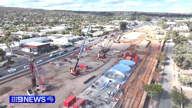 The $15.4 billion project aims to eliminate 21 sets of traffic lights, potentially reducing peak hour travel times by up to 40 minutes.