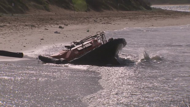 Three men rescued from treacherous waters at Point Lonsdale near Melbourne after their rig became stranded on a reef.
