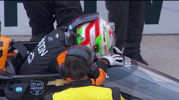 Pato O'Ward slumps forward onto the aeroscreen of his car after finishing second in the 108th Indianapolis 500.