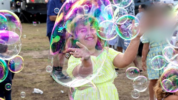 They are photos filled with laughter and joy - moments frozen in time....BEFORE the horror unfolded at Bondi. One of the photographers at Sunday's event, now with family's permission... sharing photos that will not only be cherished but carry a devastating weight.
In this moment - Matilda is happy...carefree, playing with her little sister. 