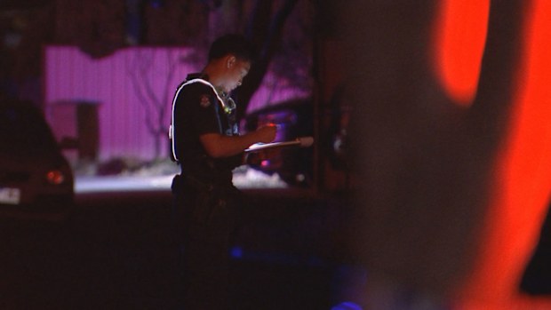 A police officer at the scene in the early hours of Saturday morning.