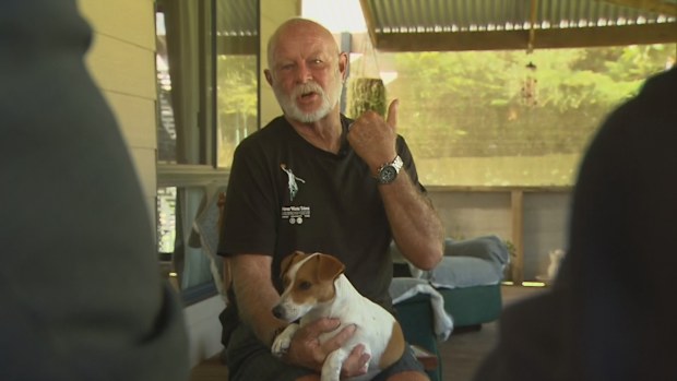 Stephen Innes and his three-legged dog, Luna.