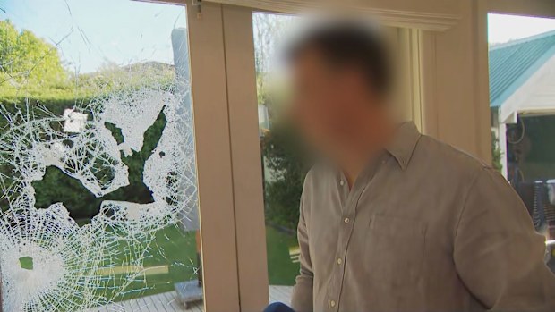 A 46-year-old father said the armed offenders were "determined" to get through their glass.