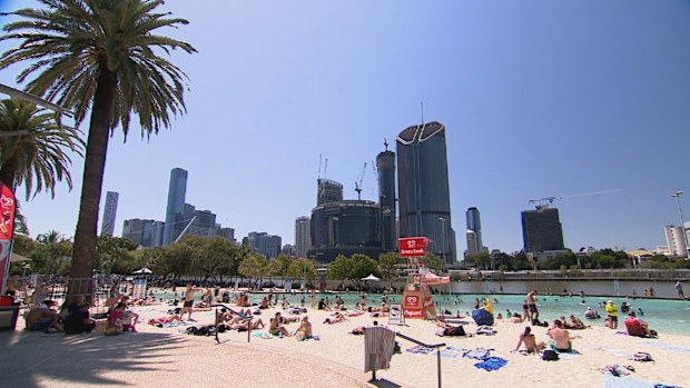 Many Queensland residents opted to head outdoors, with families flocking to the beach at Southbank to cool off, as the mercury rose to the mid 30s across the state's south-east.